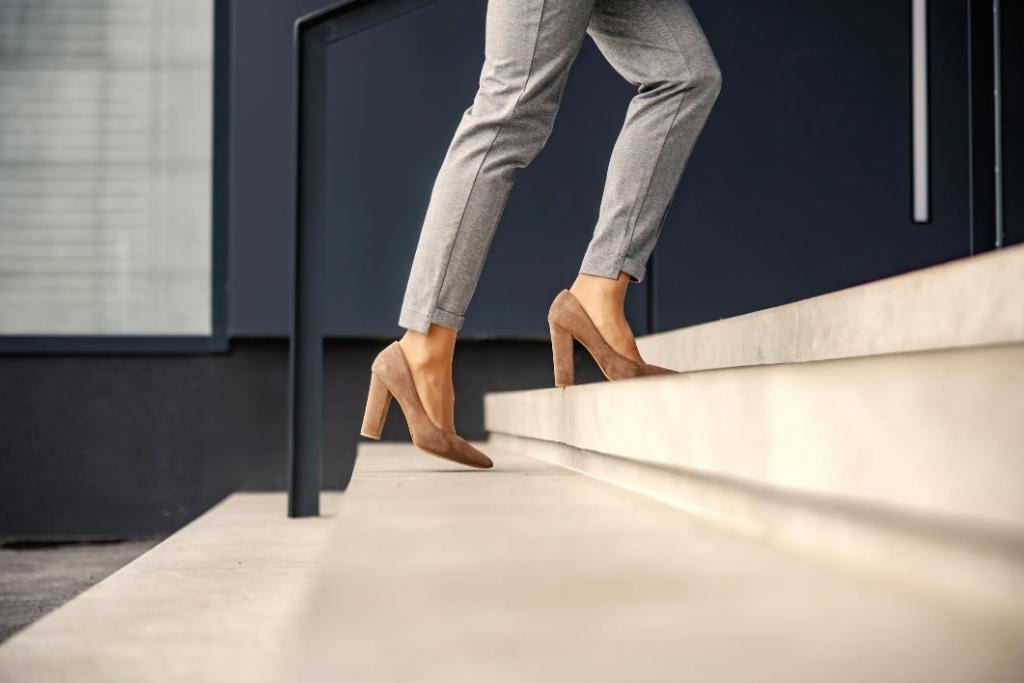 Woman ascending steps — a clear path forward