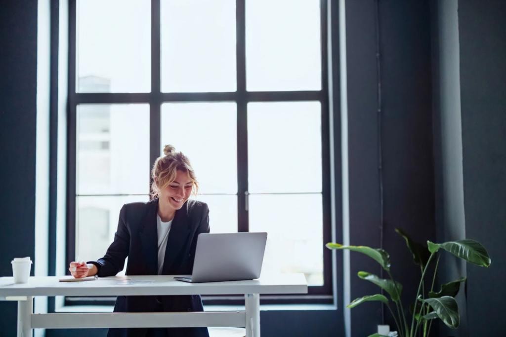 Focused, happy business owner at work